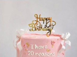 Pink buttercream birthday cake with gold topper from Youmna Gourmet Confections