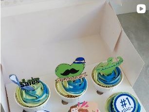 Custom decorated cupcakes with edible character toppers from Youmna Gourmet Confections